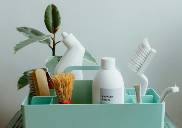 Minimalist display of eco-friendly cleaning products in pastel organizer, highlighting sustainable living.